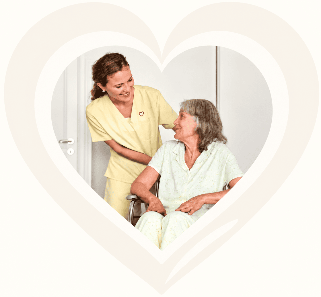 Image of a Woman Taking Care of an Old Lady in a Wheelchair